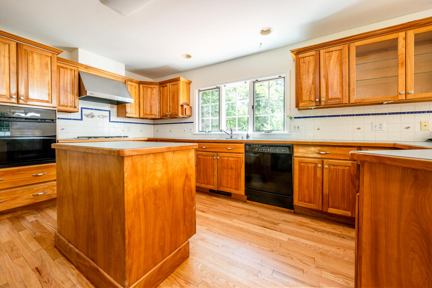 349 Little River Road Cotuit, MA 02635 - Photo 3 of 67 a kitchen with stainless steel appliances granite countertop a stove a sink and a microwave
