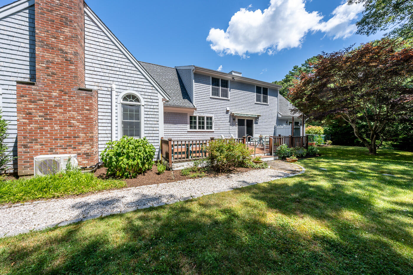 349 Little River Road Cotuit, MA 02635 - Photo 50 of 67 a front view of a house with a yard