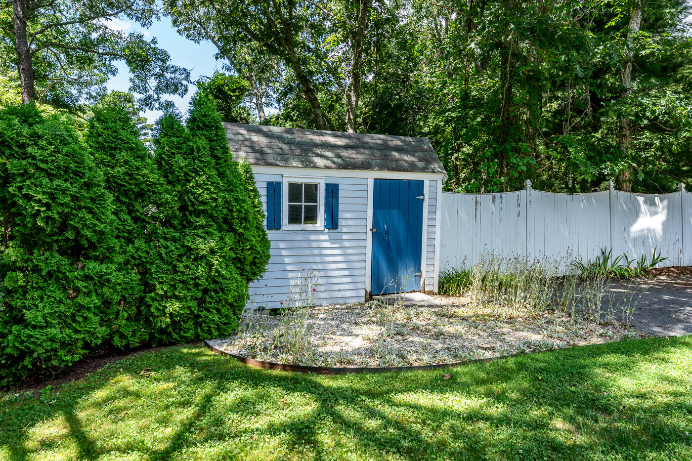 349 Little River Road Cotuit, MA 02635 - Photo 52 of 67 a backyard of a house with lots of green space