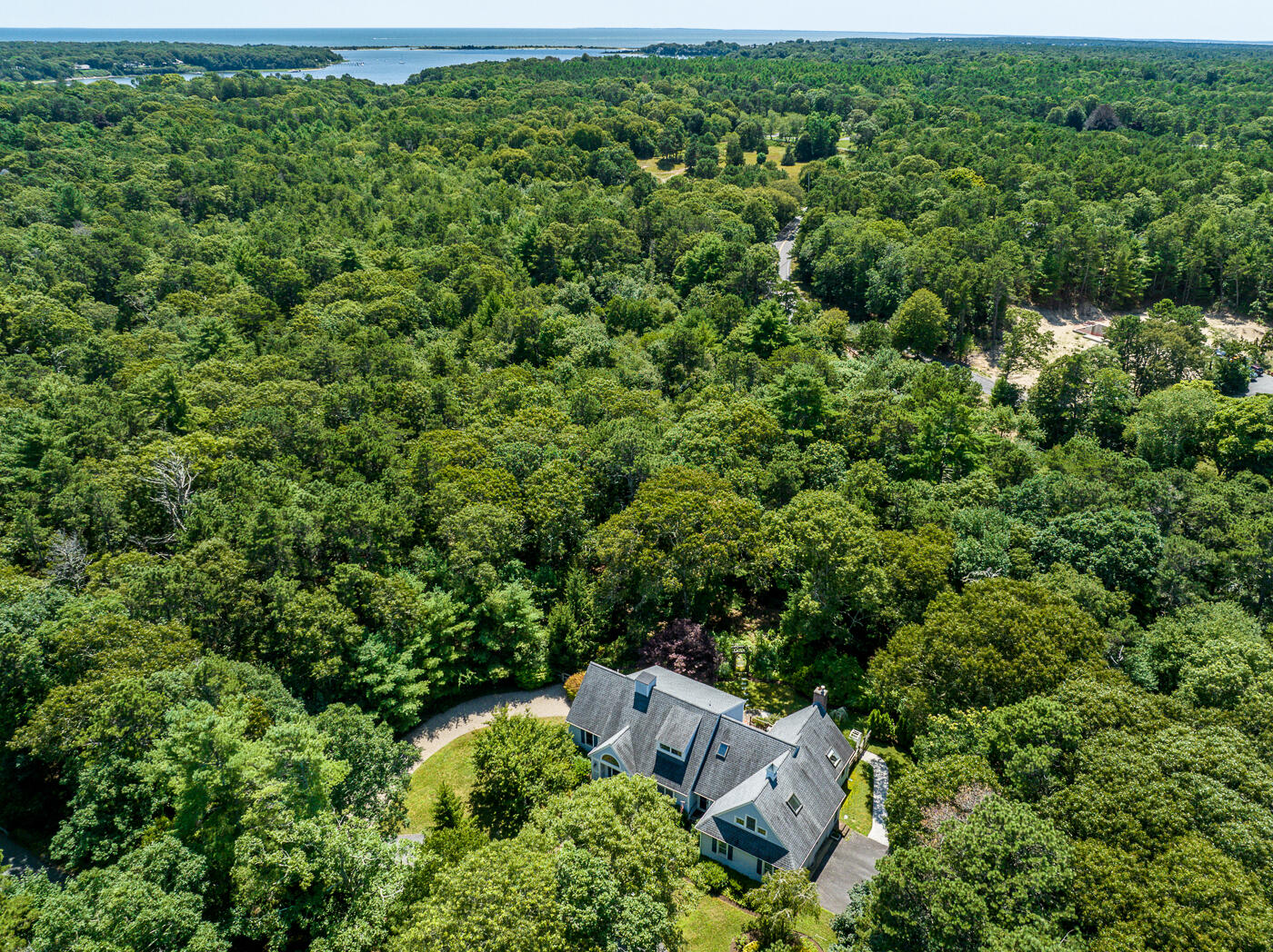 349 Little River Road Cotuit, MA 02635 - Photo 59 of 67 an aerial view of a house with a yard