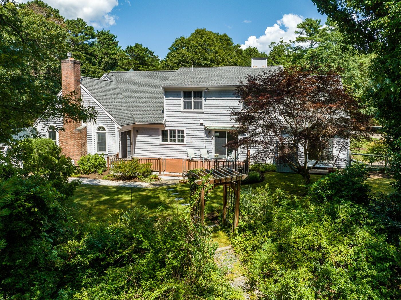 349 Little River Road Cotuit, MA 02635 - Photo 61 of 67 a aerial view of a house with a yard and potted plants