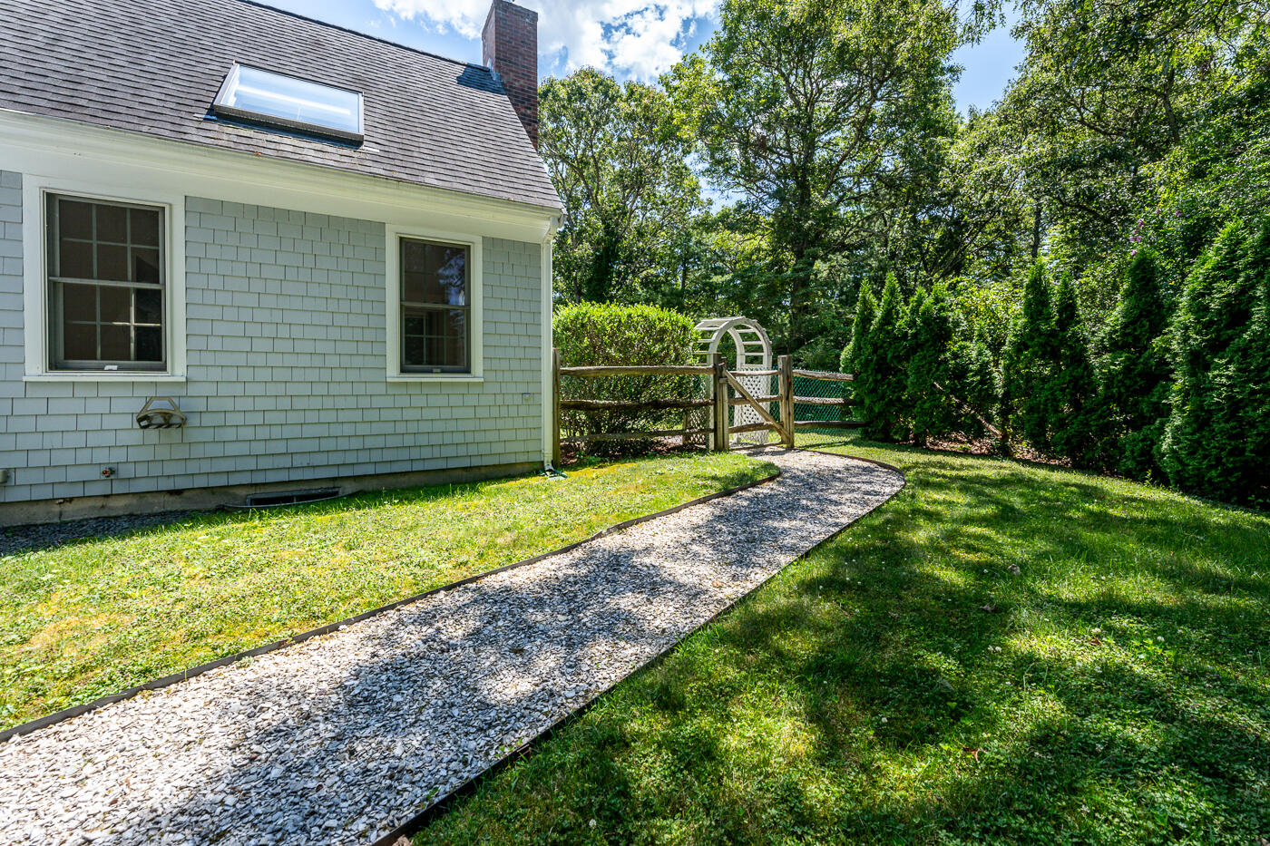 349 Little River Road Cotuit, MA 02635 - Photo 65 of 67 a view of a backyard with a garden