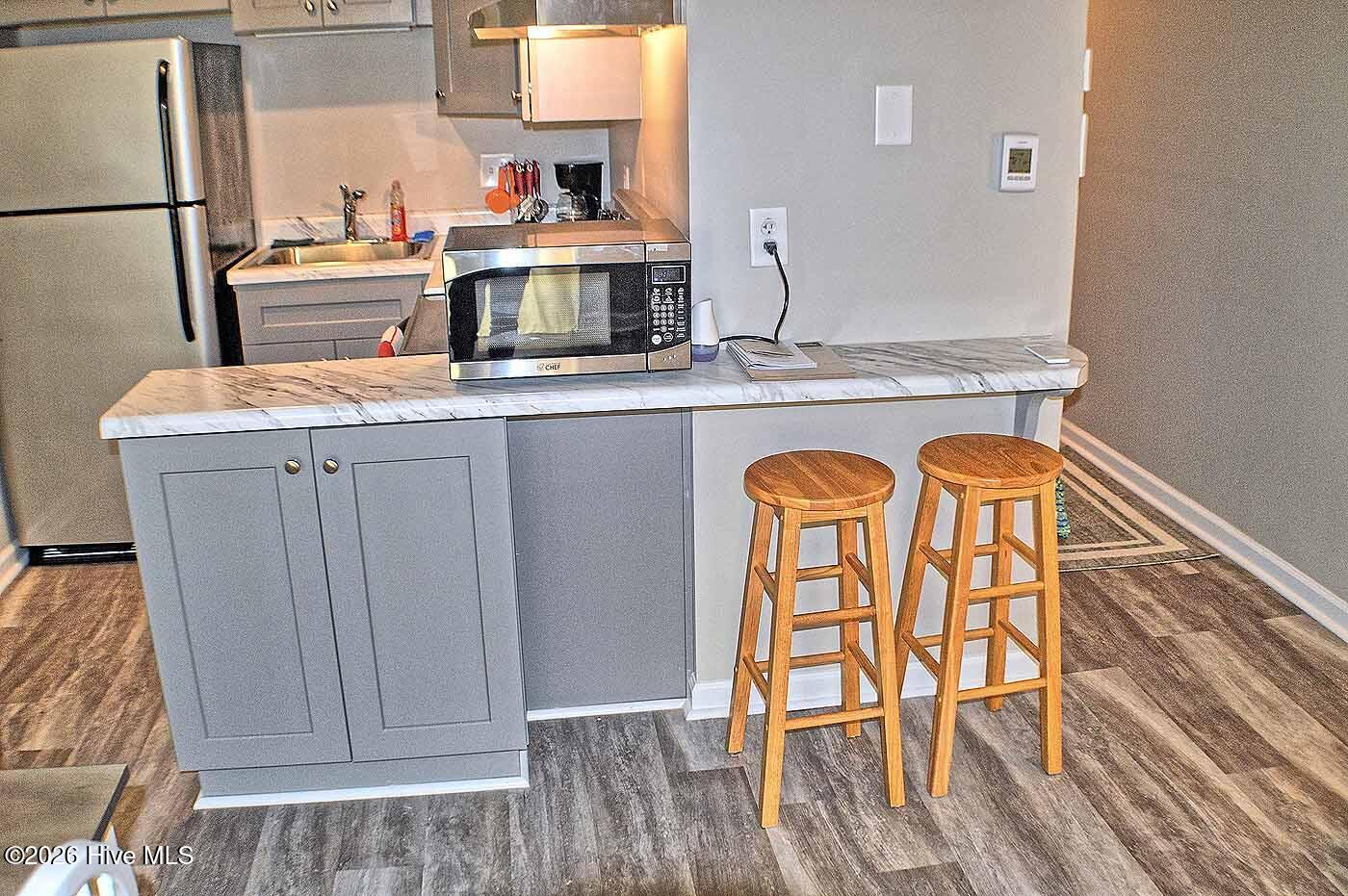 2250 New River Inlet Road, Unit 117 North Topsail Beach, NC 28460 - Photo 11 of 16 Additional Seating at Kitchen Bar