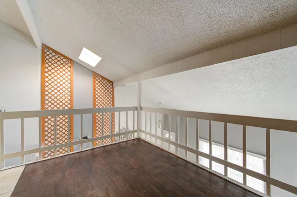 a view of staircase with wooden floor