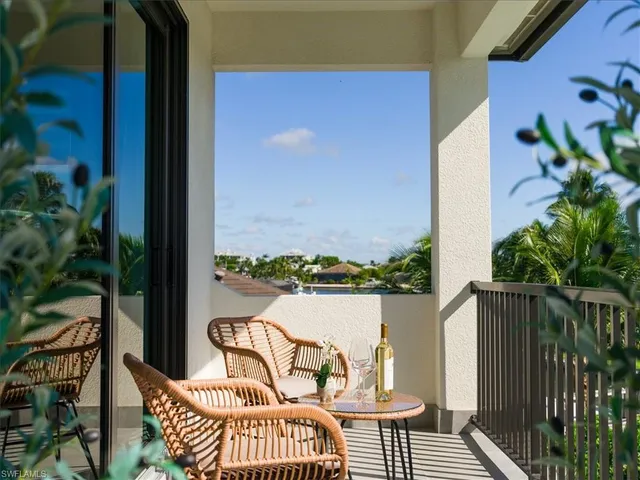a view of balcony with furniture