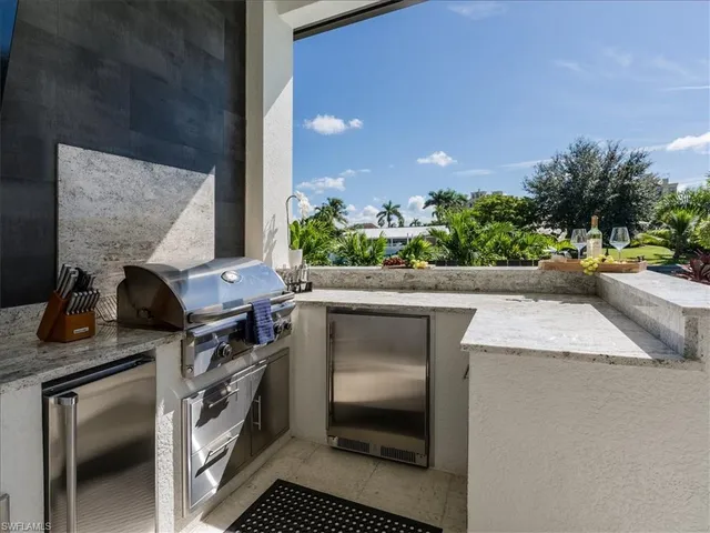 a kitchen with a sink and a stove top oven