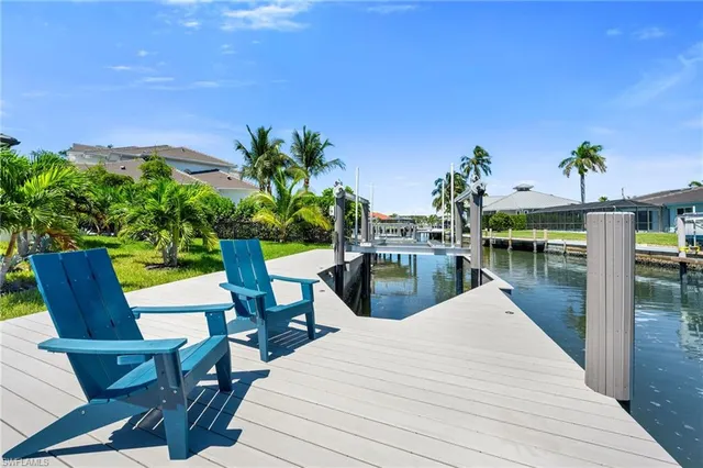 a view of a swimming pool with seating area