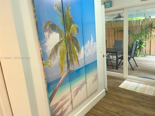 a kitchen with granite countertop a sink stove and cabinets