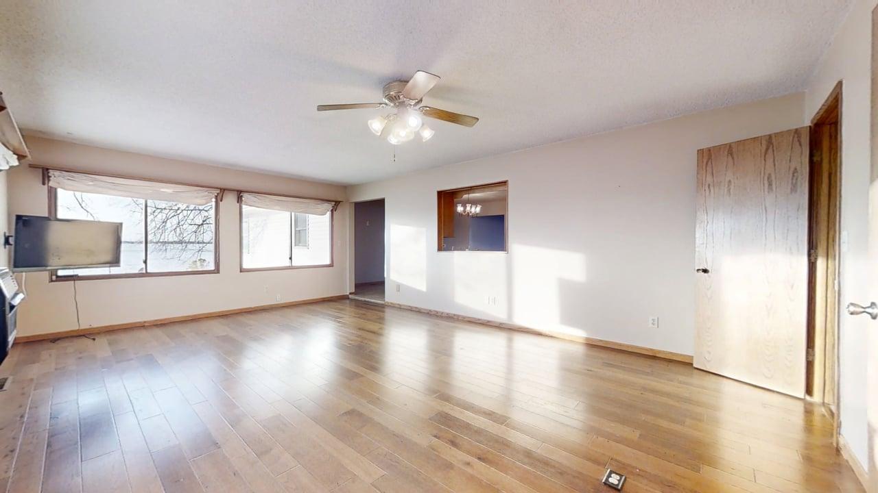 1909 County Road 2800 North Rantoul, IL 61866 - Photo 11 of 42 a view of an empty room with a window and wooden floor