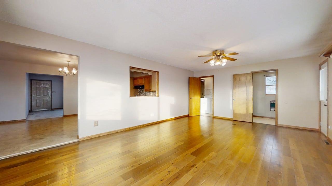 1909 County Road 2800 North Rantoul, IL 61866 - Photo 12 of 42 a view of an empty room with wooden floor and a window