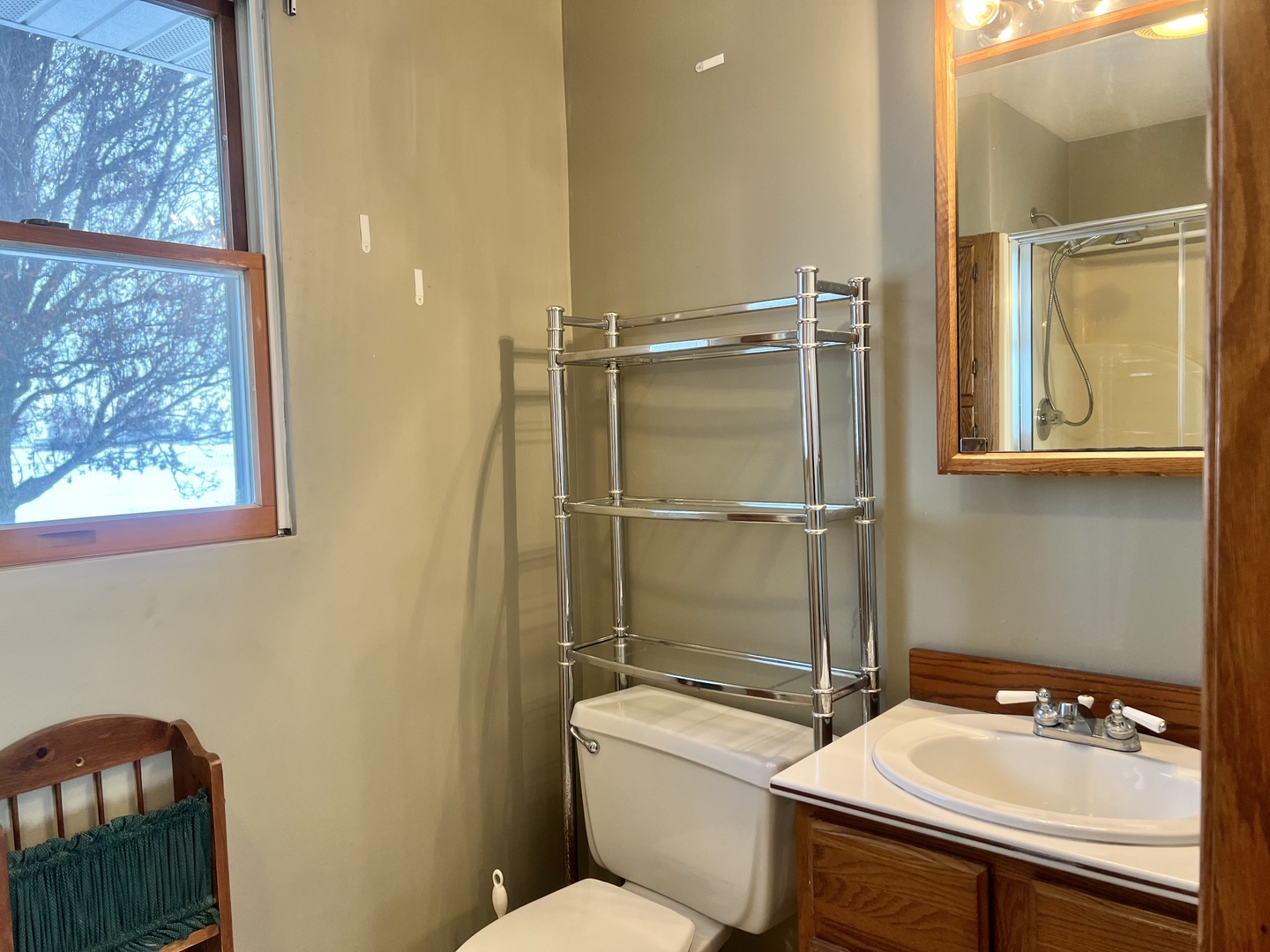1909 County Road 2800 North Rantoul, IL 61866 - Photo 15 of 42 a bathroom with a sink toilet and shower