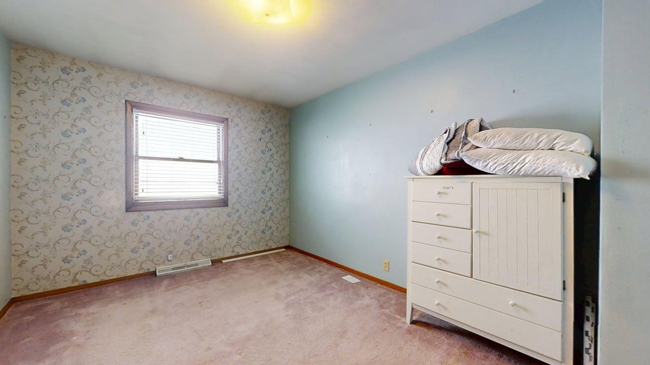 1909 County Road 2800 North Rantoul, IL 61866 - Photo 25 of 42 a room with a dresser and a window