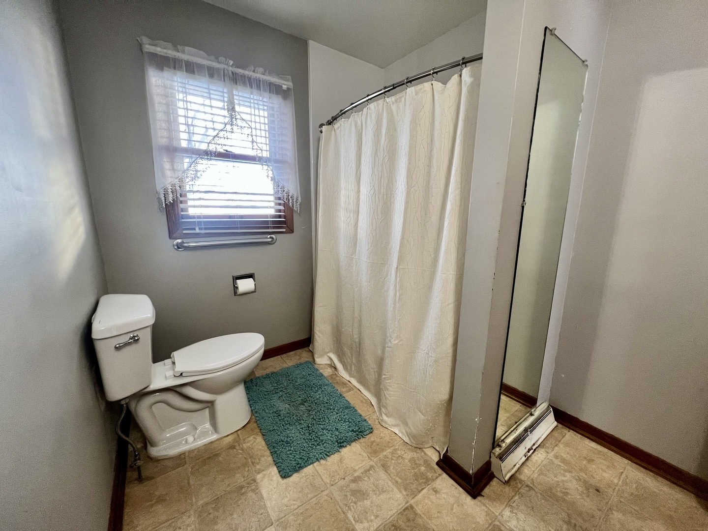 1909 County Road 2800 North Rantoul, IL 61866 - Photo 30 of 42 a bathroom with a toilet and a shower