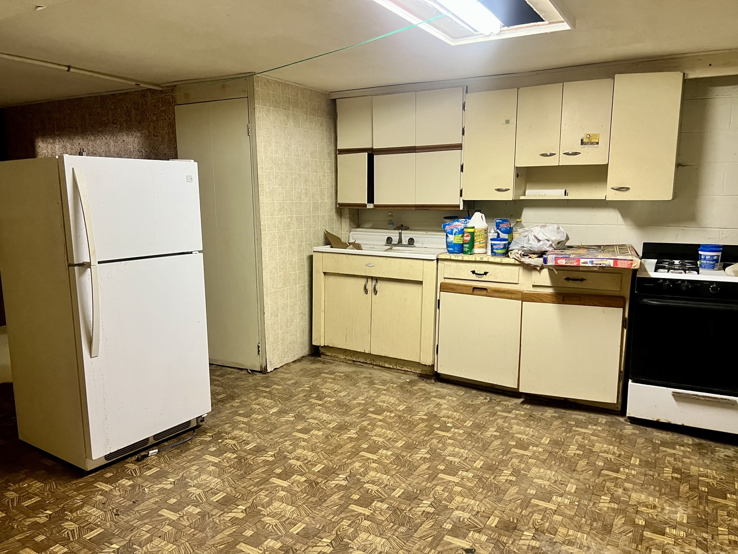 1909 County Road 2800 North Rantoul, IL 61866 - Photo 33 of 42 a kitchen with a refrigerator sink stove and cabinets