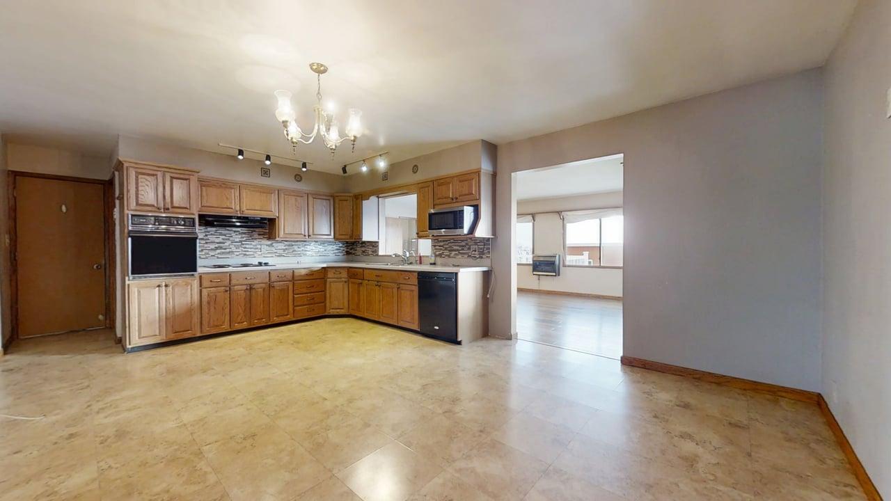1909 County Road 2800 North Rantoul, IL 61866 - Photo 6 of 42 a large kitchen with cabinets and stainless steel appliances