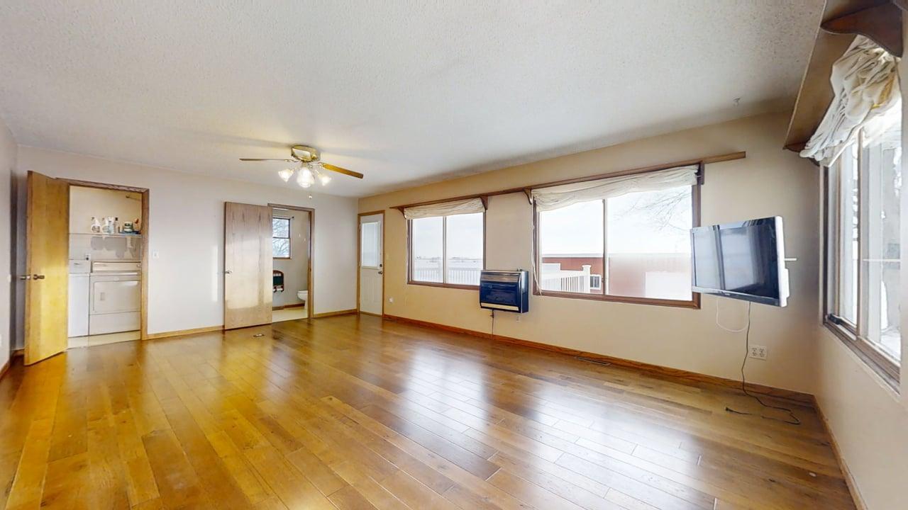 1909 County Road 2800 North Rantoul, IL 61866 - Photo 9 of 42 a view of an empty room with a window and wooden floor