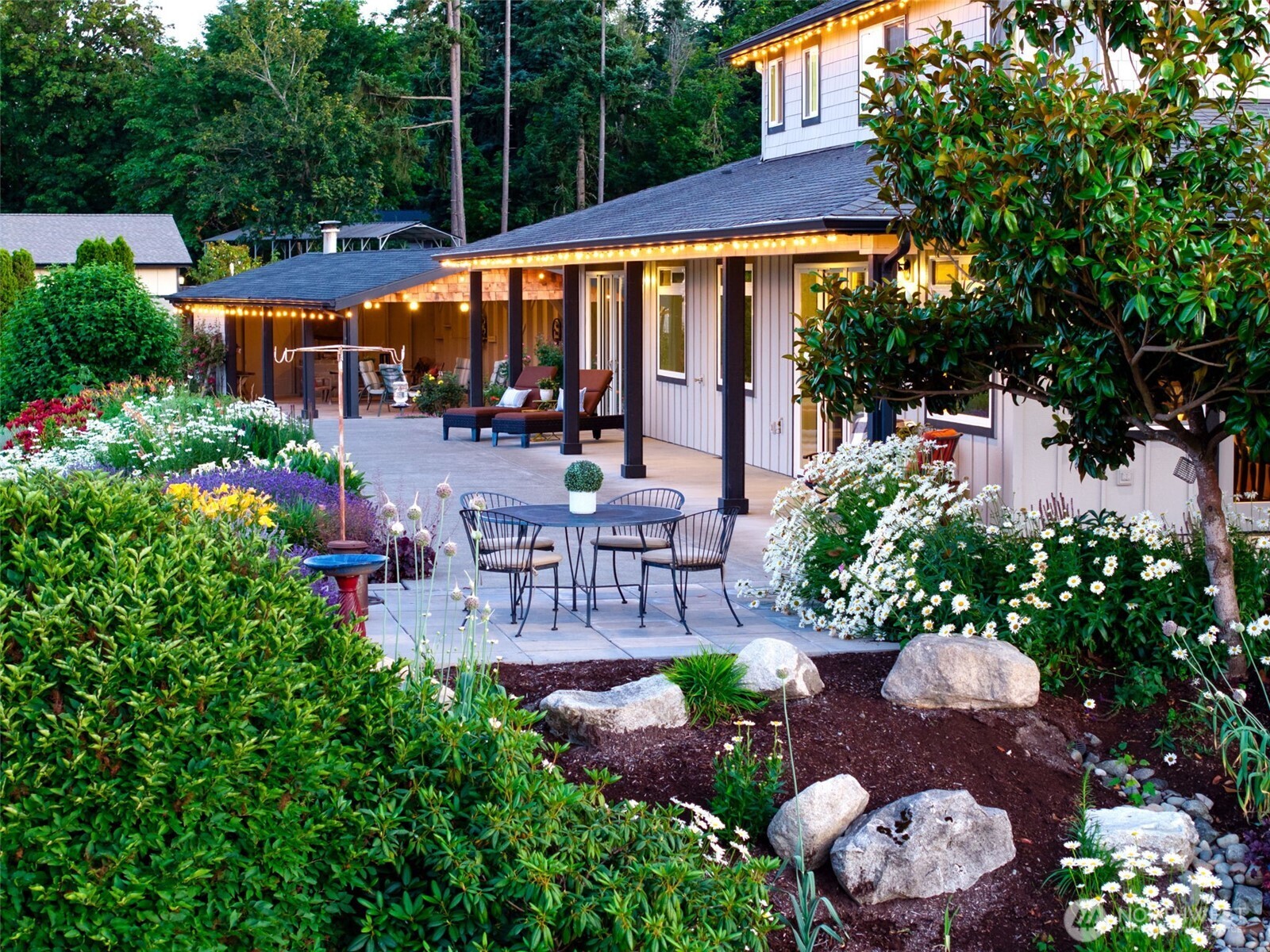 30721 40th Avenue South Roy, WA 98580 - Photo 26 of 40 a view of a patio with table and chairs potted plants