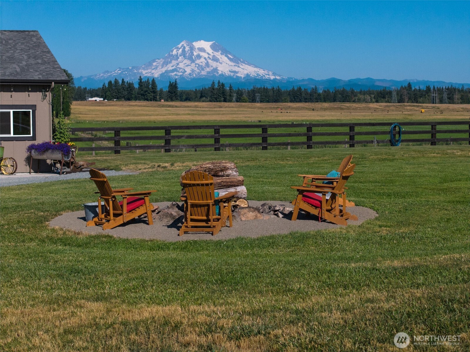 30721 40th Avenue South Roy, WA 98580 - Photo 29 of 40 a view of a lake with lawn chairs and a big yard