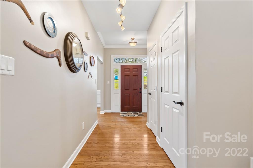 5677 Berry Ridge Drive Harrisburg, NC 28075 - Photo 2 of 24 a view of a hallway with painted walls