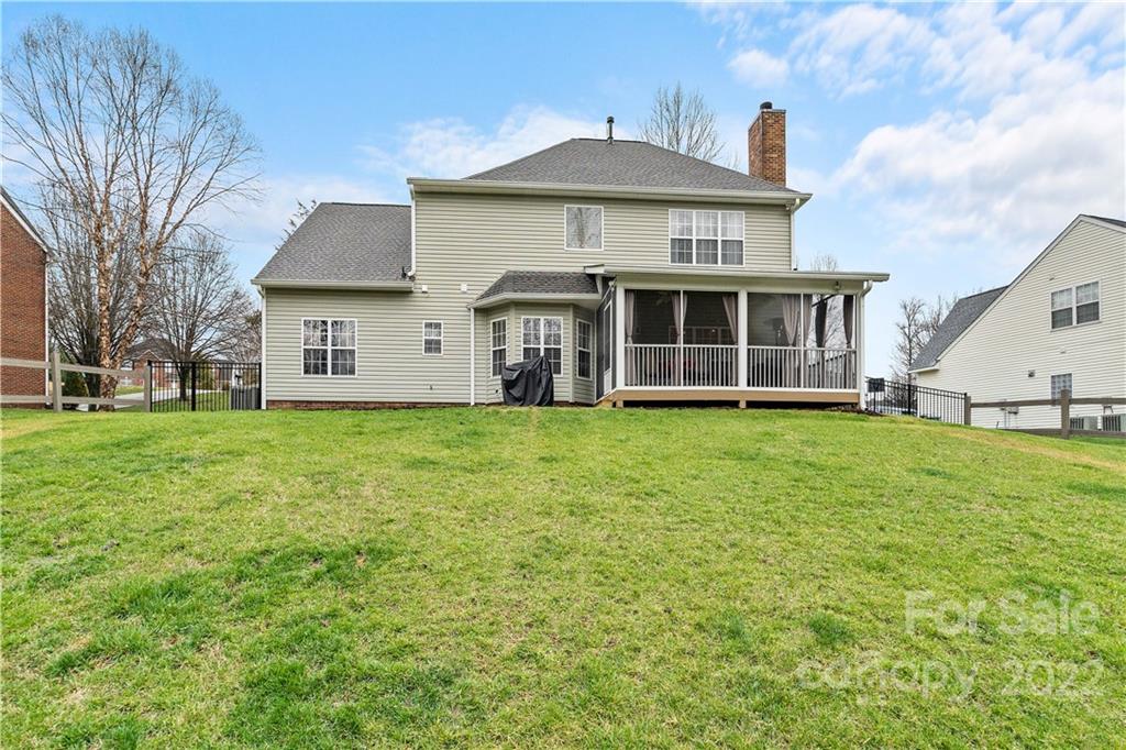 5677 Berry Ridge Drive Harrisburg, NC 28075 - Photo 22 of 24 a front view of a house with a yard