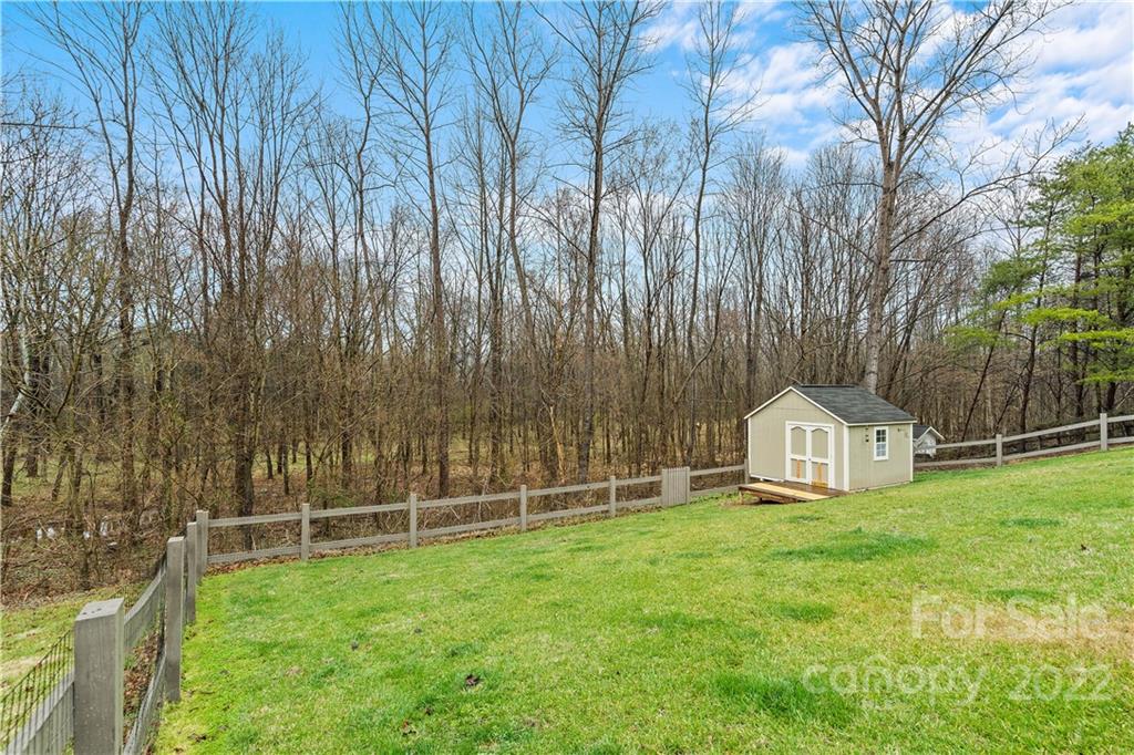 5677 Berry Ridge Drive Harrisburg, NC 28075 - Photo 23 of 24 a view of yard with small cabin and wooden fence