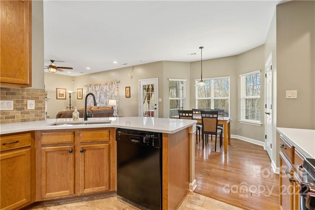 5677 Berry Ridge Drive Harrisburg, NC 28075 - Photo 9 of 24 a kitchen with counter top space and dining table