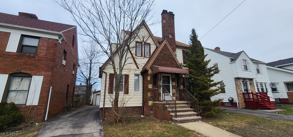 3599 Grosvenor Road Cleveland, OH 44118 - Photo 1 of 25 View of front of home with a chimney and an outbuilding