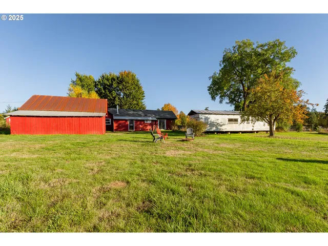 a backyard of a house with lots of green space