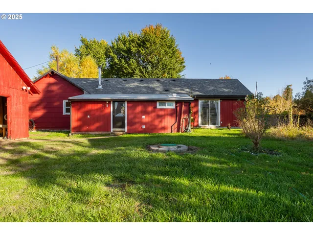 a view of a house with outdoor space and sitting area