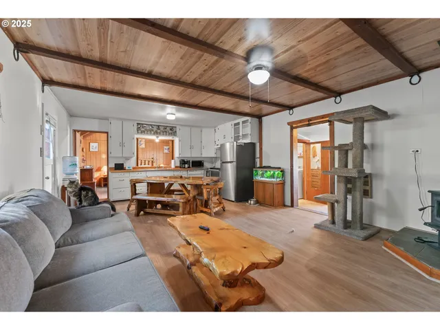 a living room with furniture and large window