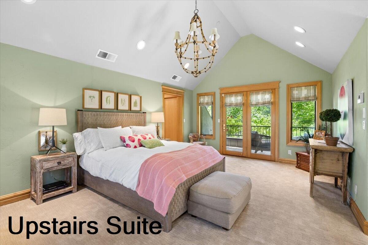 500 Ashland Loop Road Ashland, OR 97520 - Photo 40 of 67 a bedroom with a bed and a large window