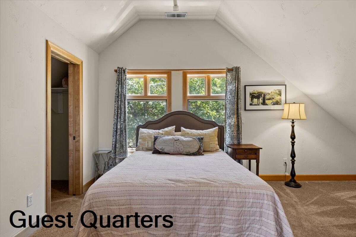 500 Ashland Loop Road Ashland, OR 97520 - Photo 48 of 67 a bedroom with a bed and a large window