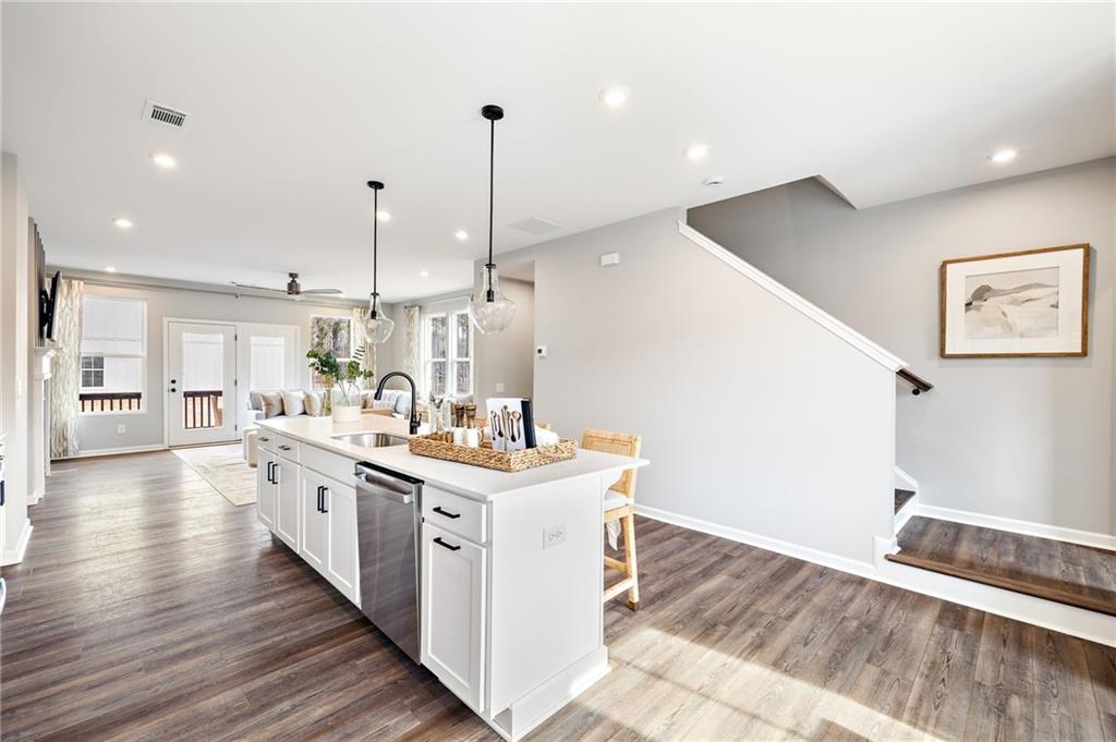 801 Cameron Trail Acworth, GA 30102 - Photo 19 of 36 a kitchen with a sink stove and wooden floor