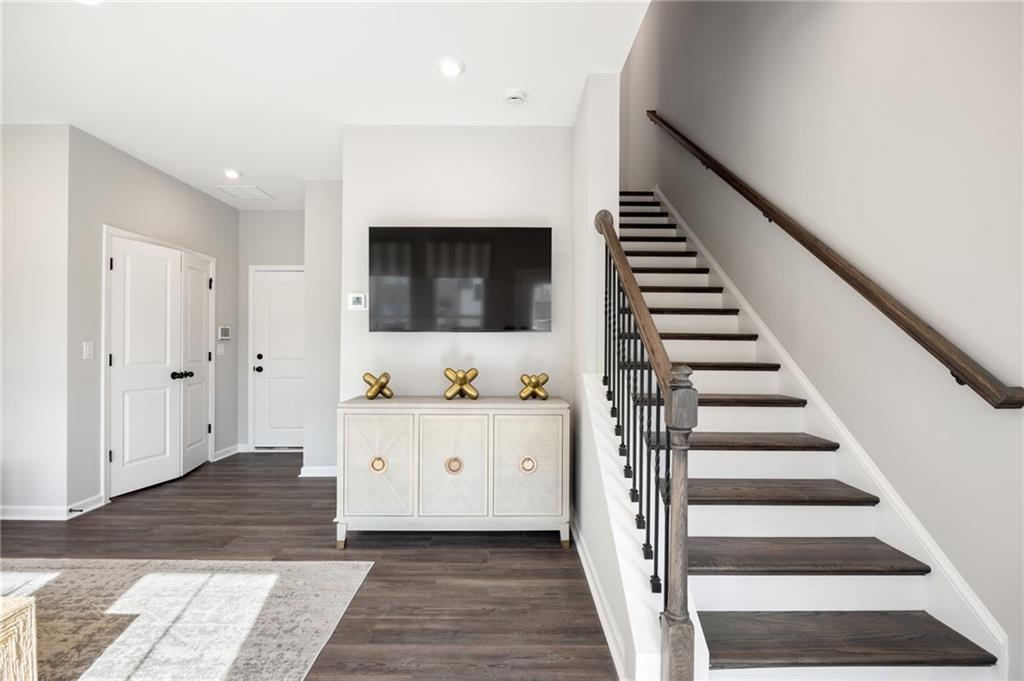 801 Cameron Trail Acworth, GA 30102 - Photo 6 of 36 a hallway with wooden floor and white walls