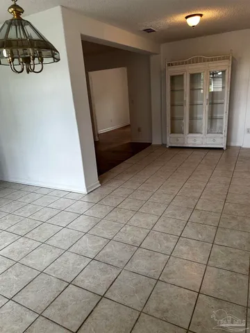 an empty room with wooden floor