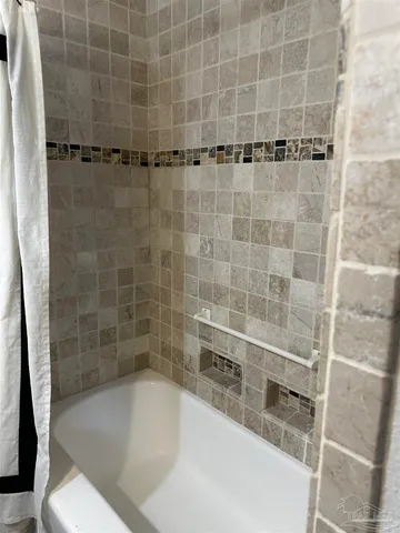 a view of a room with wooden floor and window