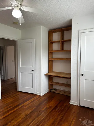 a view of room with wooden floor and window