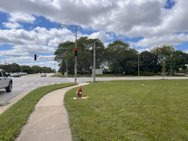 a view of a swimming pool and a yard