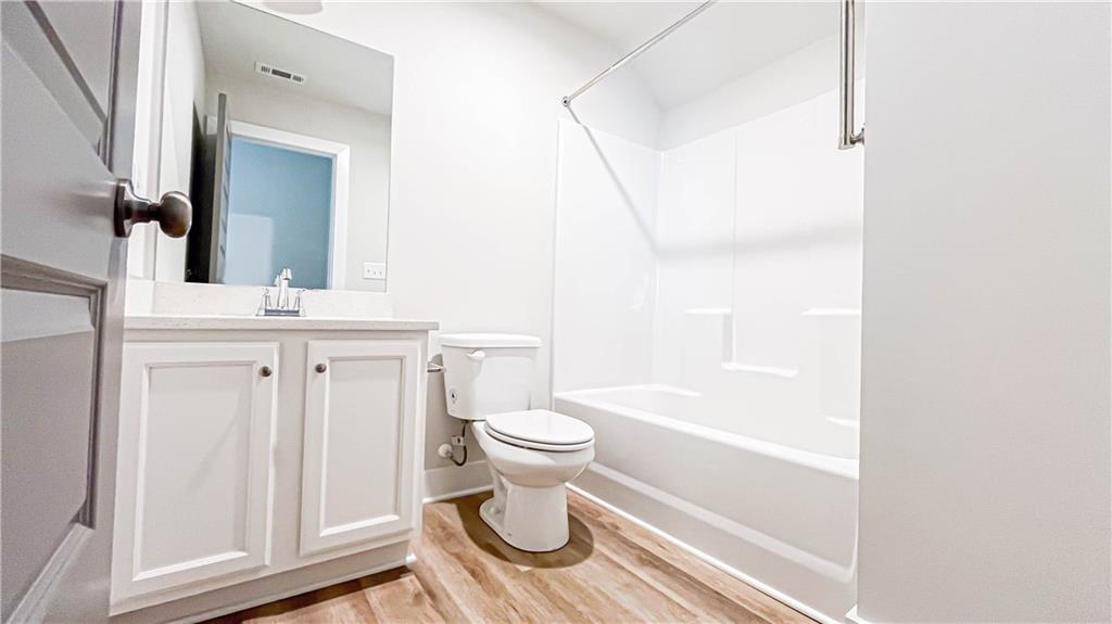740 Eudora Welty Way Athens, GA 30607 - Photo 41 of 57 a bathroom with a sink a toilet and a mirror