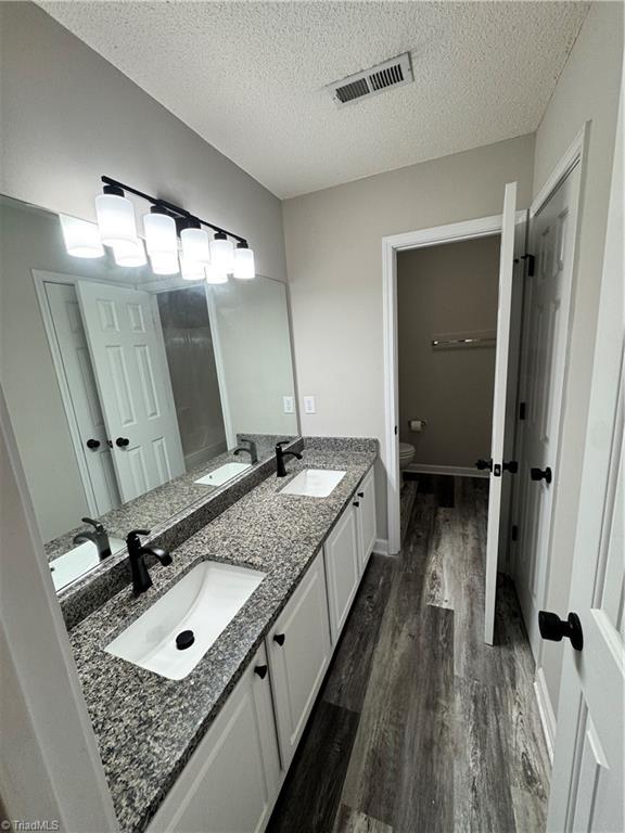 609 Huntingdon Street Elon, NC 27244 - Photo 11 of 13 Upstairs Bathroom Bath with Double Sinks
