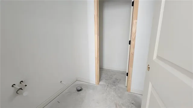 a bed sitting in a room next to a window