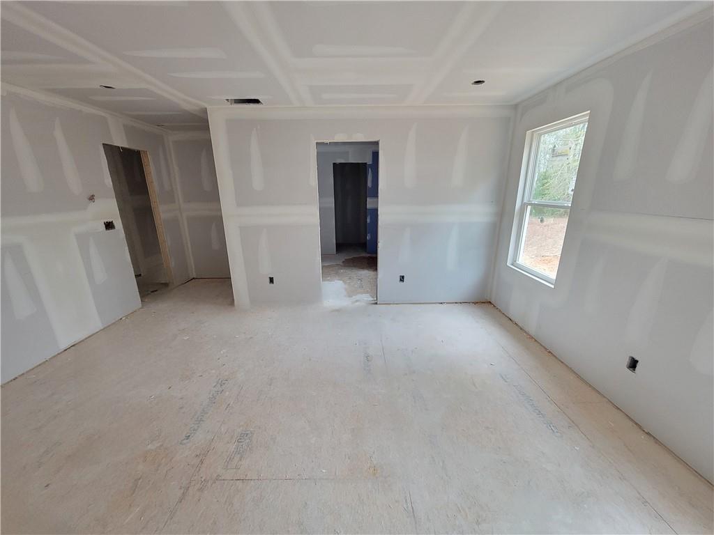 268 Silverleaf Trail Bethlehem, GA 30620 - Photo 8 of 22 an empty room with windows and closet