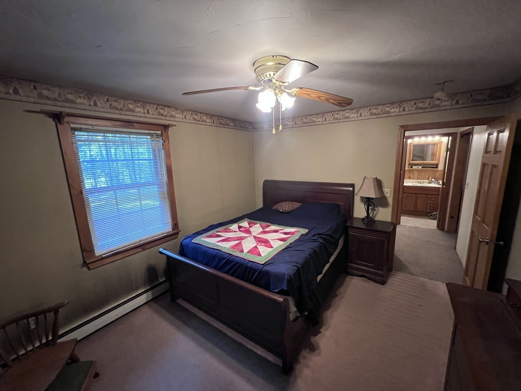 115 Town Farm Road Orange, MA 01364 - Photo 11 of 13 a living room with furniture and a flat screen tv