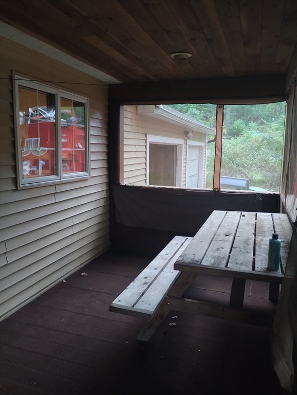 115 Town Farm Road Orange, MA 01364 - Photo 4 of 13 a bed sitting in a bedroom next to a window