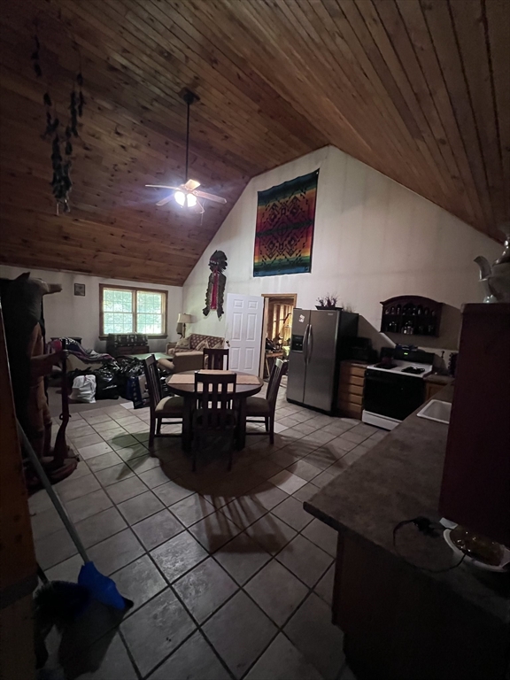 115 Town Farm Road Orange, MA 01364 - Photo 7 of 13 a living room with lots of chairs and a projector screen