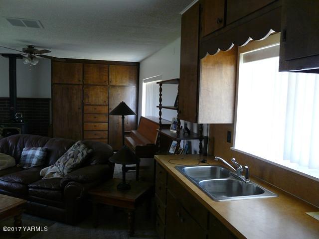 1200 Rosenkranz Road Tieton, WA 98947 - Photo 6 of 17 a kitchen with a sink and a refrigerator