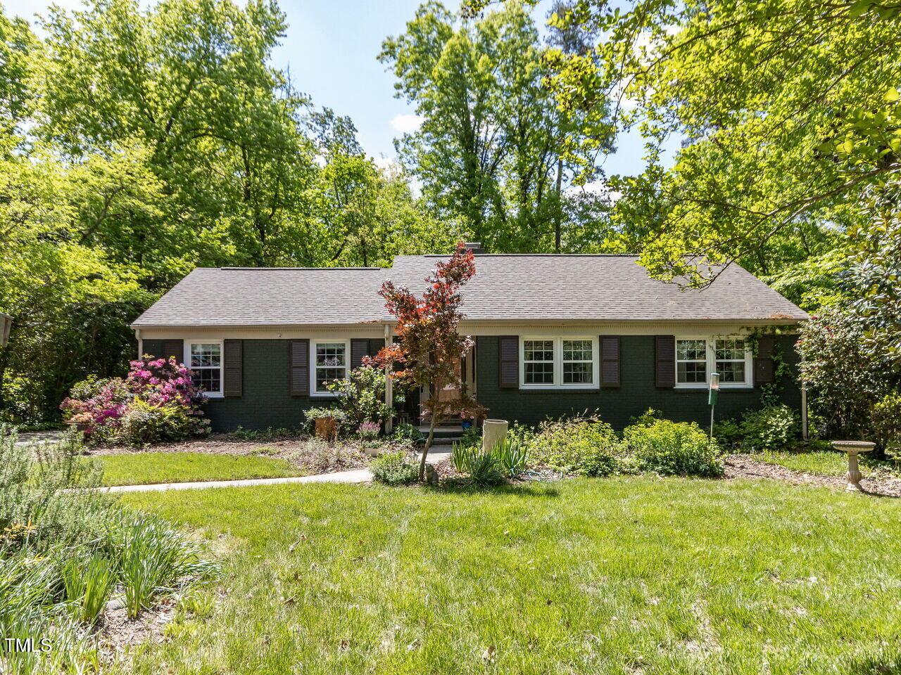 713 Macon Place Raleigh, NC 27609 - Photo 1 of 36 a front view of a house with garden