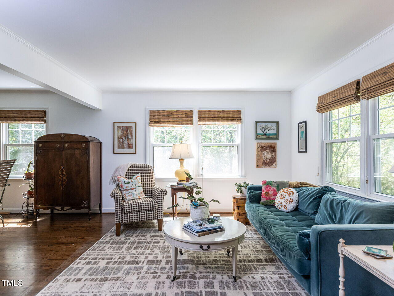 713 Macon Place Raleigh, NC 27609 - Photo 13 of 36 a living room with furniture and a large window