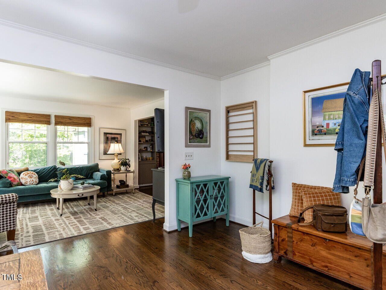 713 Macon Place Raleigh, NC 27609 - Photo 16 of 36 a living room with furniture floor to ceiling window and wooden floor