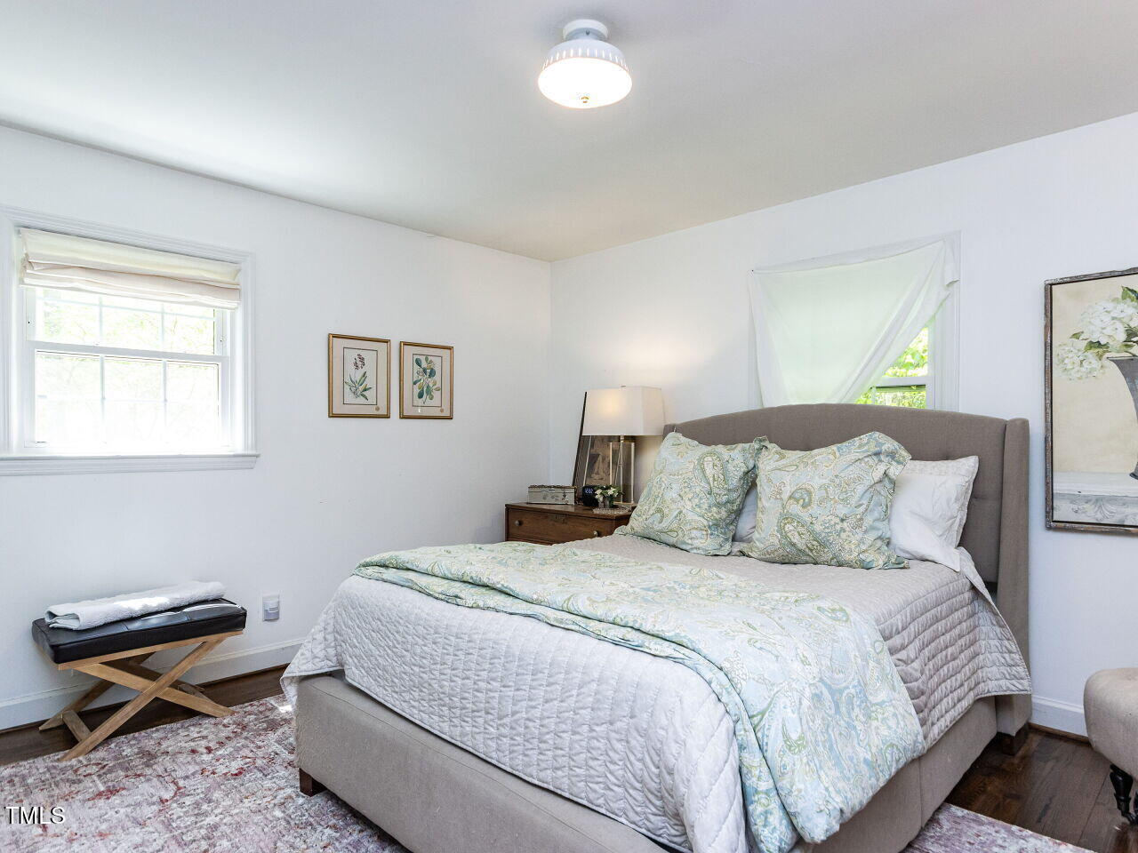 713 Macon Place Raleigh, NC 27609 - Photo 18 of 36 a bedroom with a bed and a window